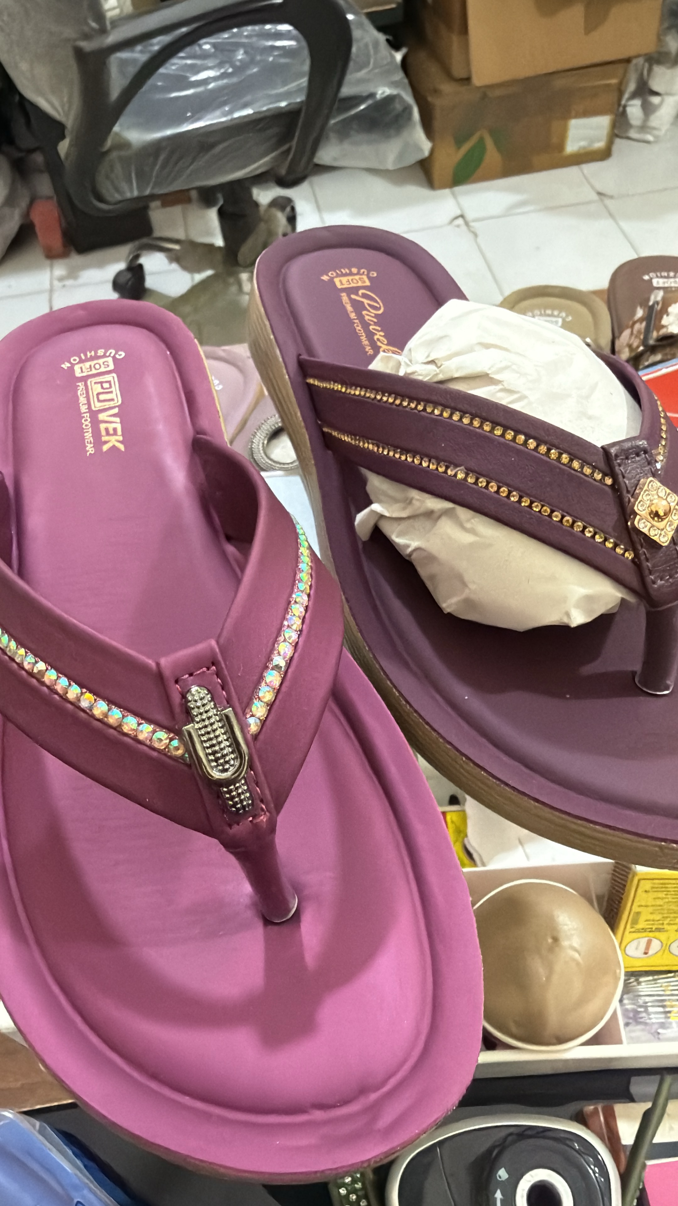 Cherry and wine PUVEK sandals shown close together
